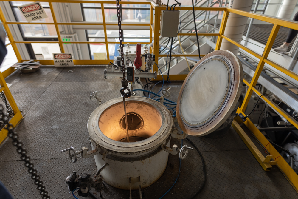 IperionX team loads a furnace to produce low cost, low carbon titanium powder from either titanium mineral feedstock or recycled titanium scrap feedstock.
